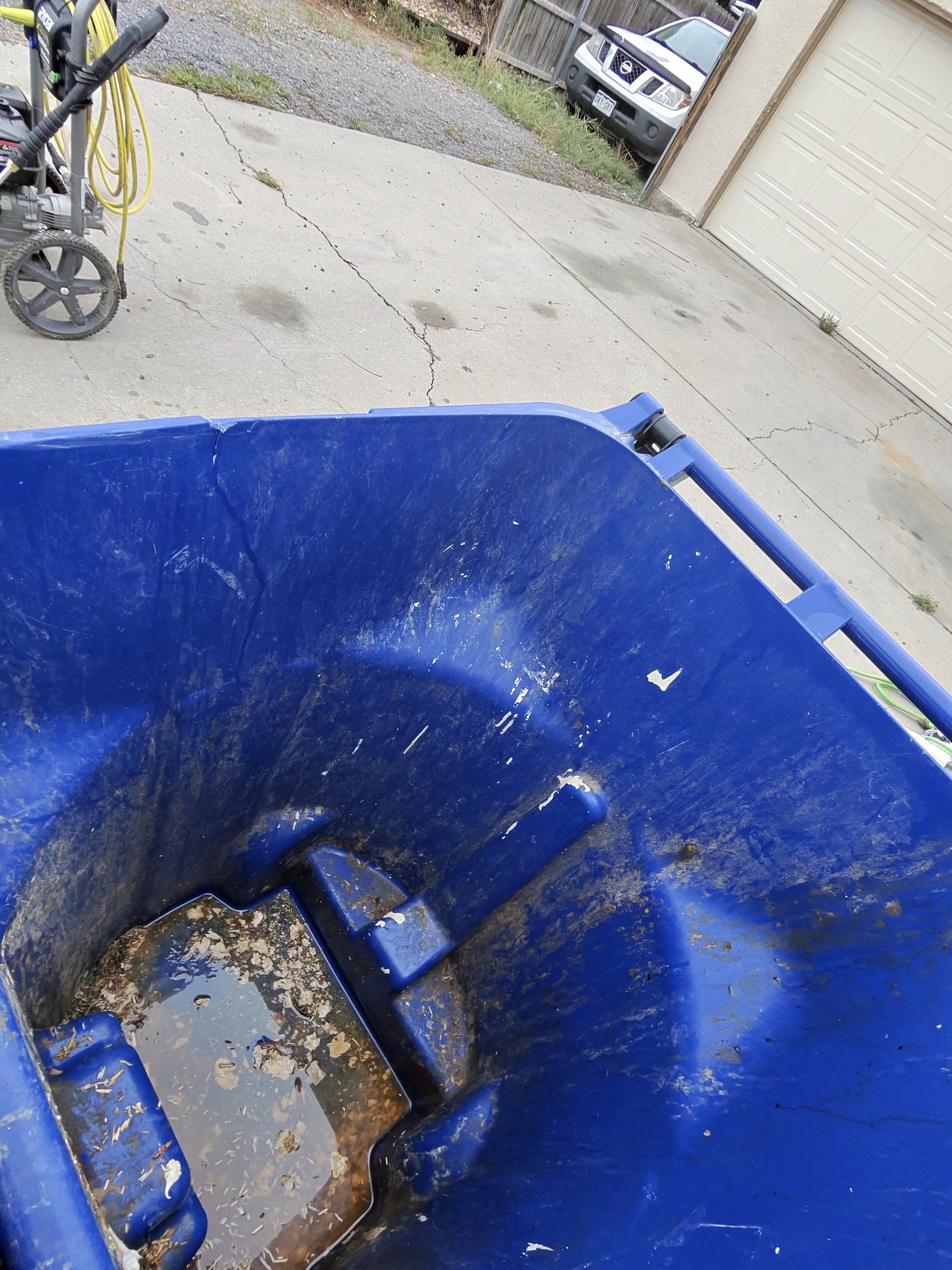 Residential trash can before cleaning with visible buildup